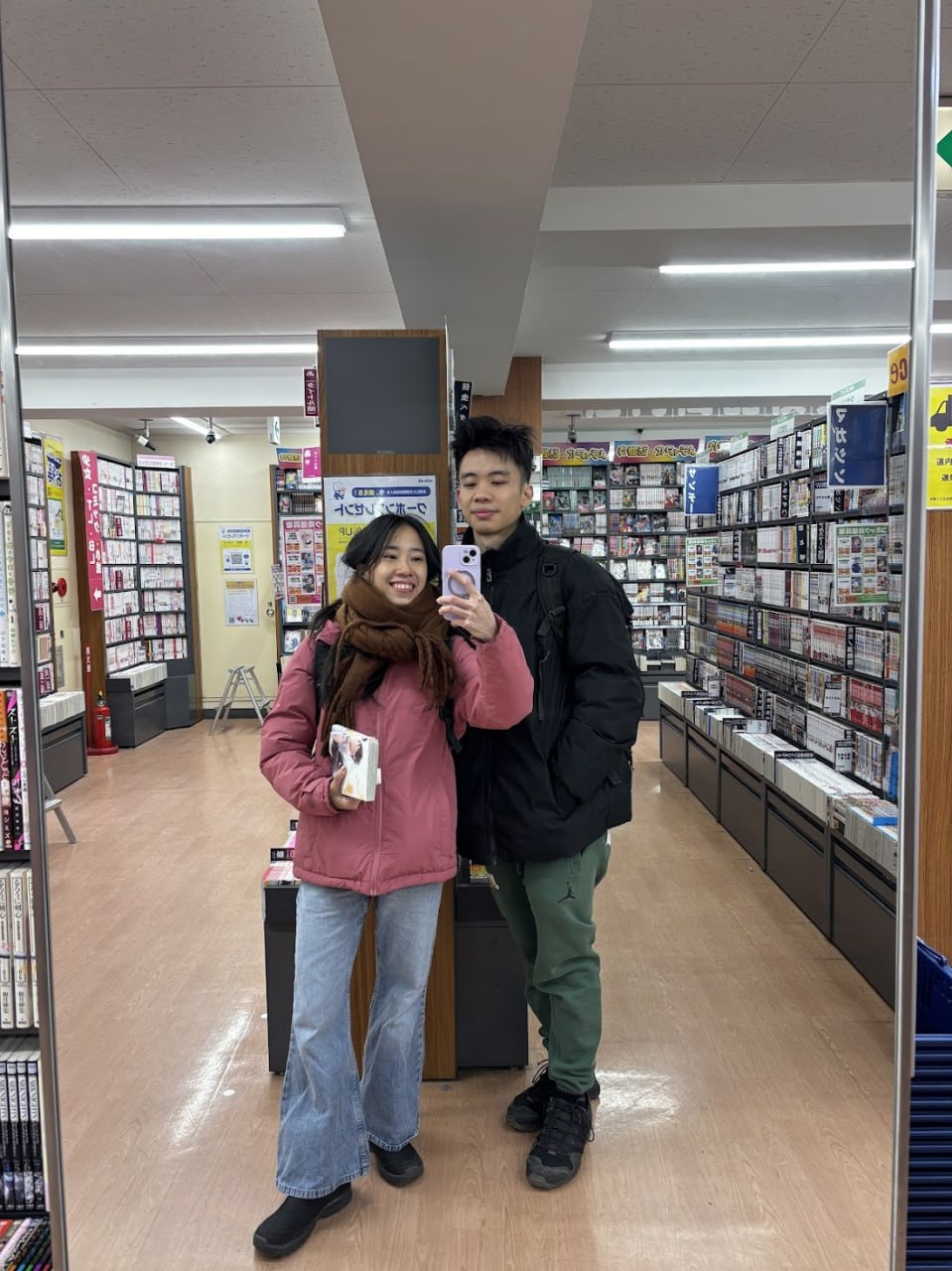 Couple mirror selfie at a Sapporo bookstore